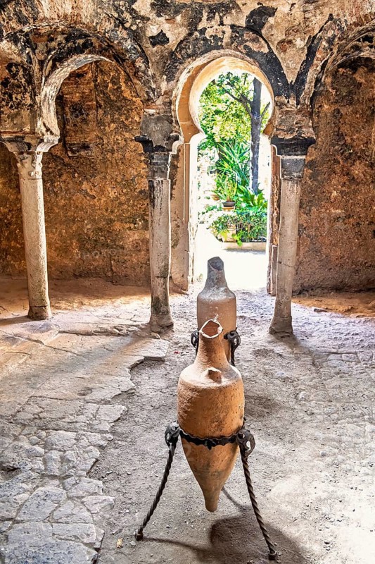 Interior at Banys Arabs Baths with old amphoras, a historic site with Islamic architecture, Palma de Mallorca, Mallorca, Spain