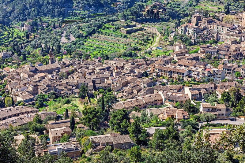 Aerial view at a mountain village with old houses in a valley, Valldemossa, Mallorca, Spain