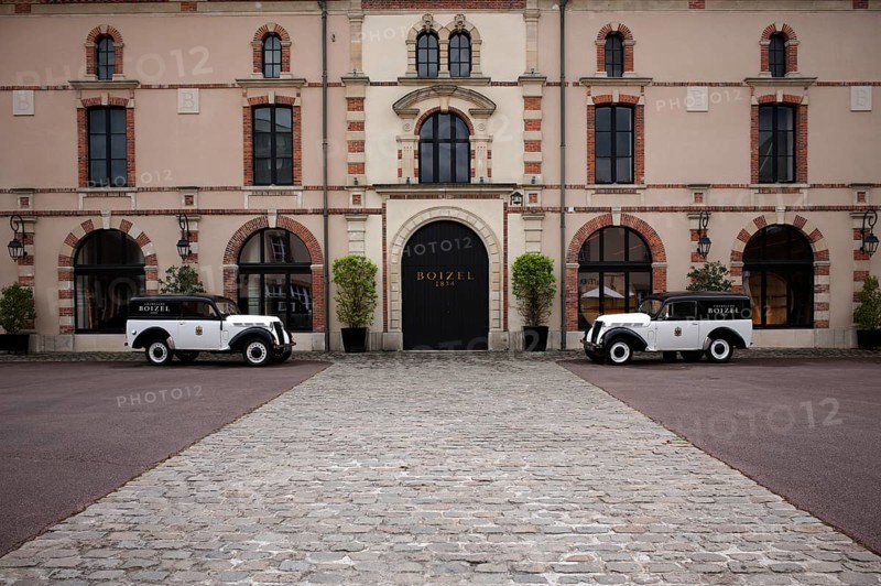Black and white Renault Juvaquatre Editorial vintage cars in front of headquarters, head office, Atelier 1834 Champagne Boizel, Avenue de Champagne, Épernay, Marne, France