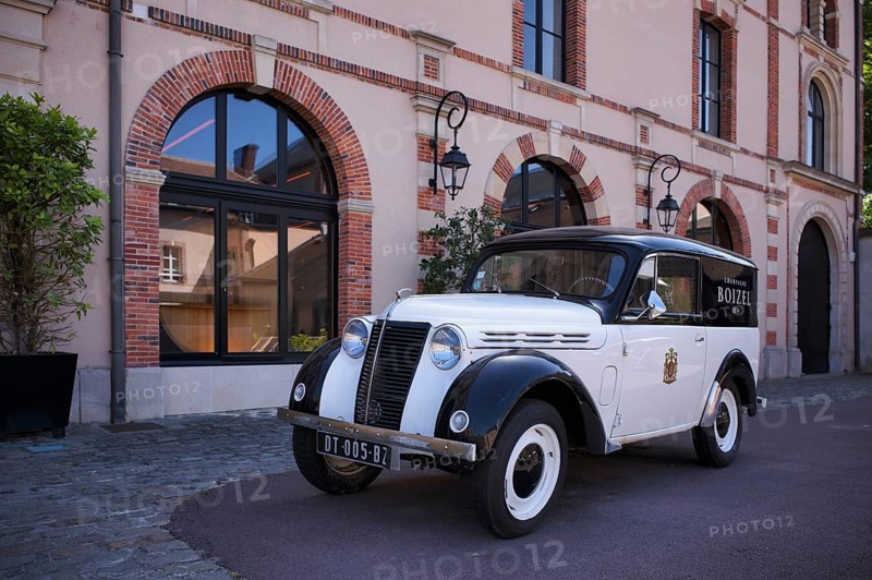 Black and white Renault Juvaquatre Editorial vintage car in front of headquarters, head office, Atelier 1834 Champagne Boizel, Avenue de Champagne, Épernay, Marne, France