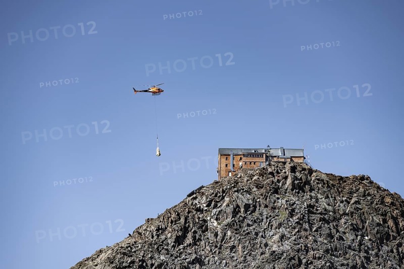 Becherhaus mountain hut on the summit of the Becher, helicopter to supply the mountain hut, Stubai Alps, South Tyrol, Italy