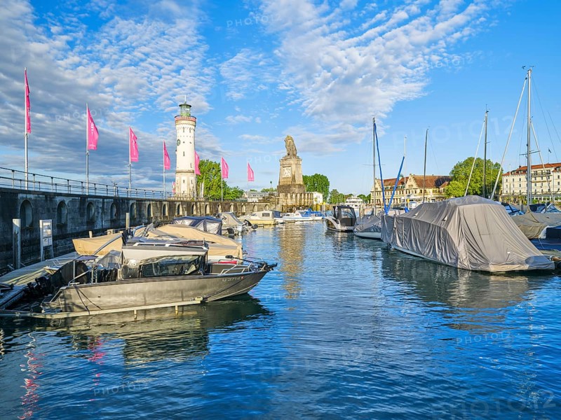 Harbour with lighthouse and lion statue in Lindau, Lake Constance, lake, blue sky, morning, boats, Lindau, Swabia, Bavaria, Germany