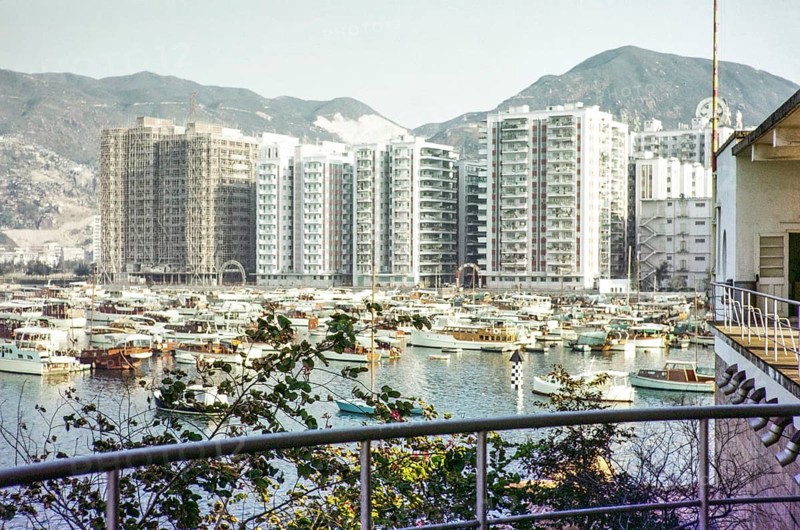 High rise apartment buildings and boats including yachts view from Royal Hong Kong Yacht Club, Kellet Island, Causeway Bay, Hong Kong, Asia 1964