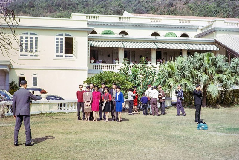 People taking family photos in garden of Repulse Bay Hotel, Repulse Bay, Hong Kong, Asia 1964