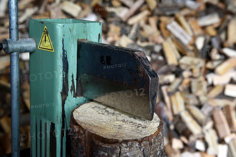 Firewood, splitting with a log splitter, axe