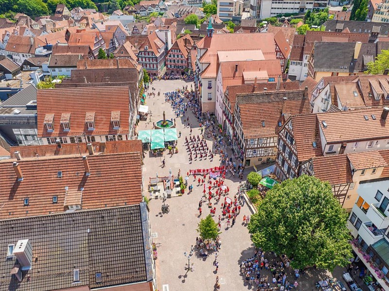 Aerial view of a historic town centre with an event and traditional architecture, 950 years of Calw, Calw parade, Black Forest, Germany