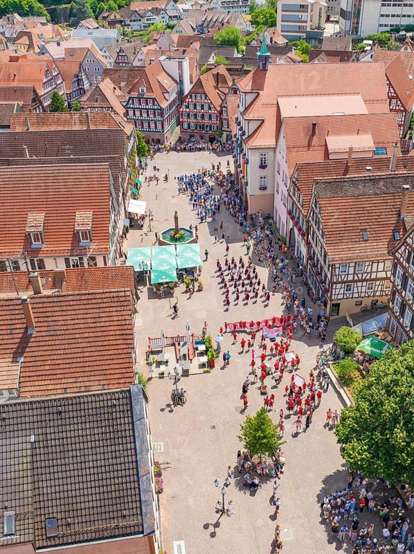 Aerial view of an old town with half-timbered houses and a gathering of people, 950 years of Calw, Calw parade, Black Forest, Germany