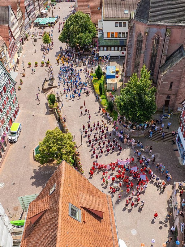 Aerial view of a celebration in a historic town with half-timbered architecture and many people, 950 years of Calw, Calw parade, Black Forest, Germany