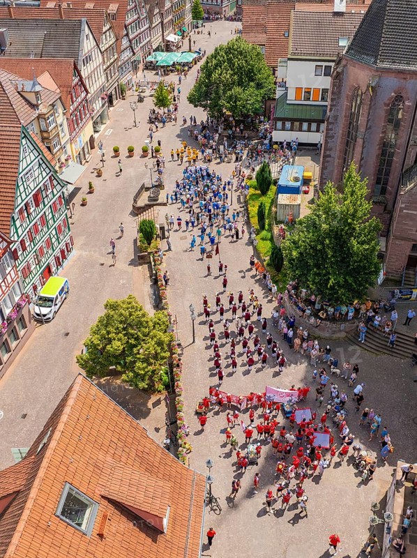 Large crowd at a street festival, surrounded by half-timbered architecture and summer weather, 950 years of Calw, Calw parade, Black Forest, Germany
