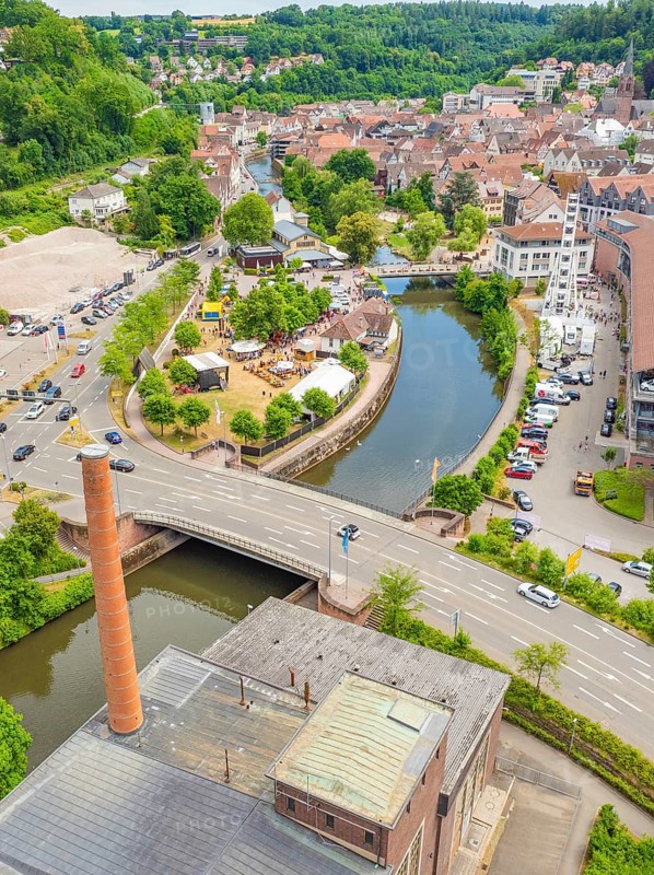Aerial view of a cityscape with river, park and bridge in green surroundings, 950 years of Calw, Calw parade, Black Forest, Germany