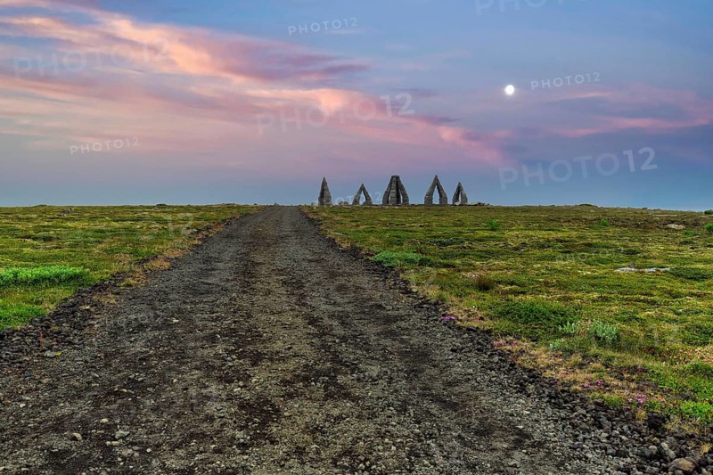 Gravel path to the Arctic Henge, large stone gates, basalt, landmark in barren landscape, Heimskautsgerði, Heimskautsgerdi, artist Erlingur Thorodsen, evening sky, Raufarhöfn, Melrakkasletta, North-East Iceland, Iceland