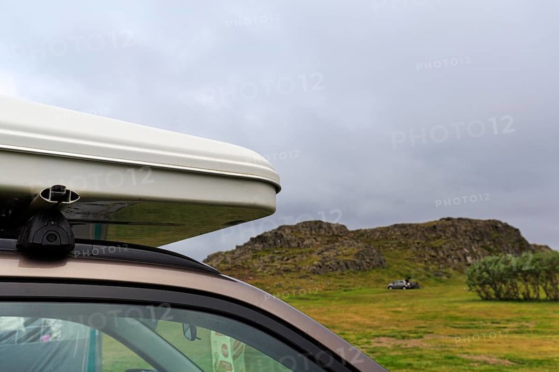 Rooftop tent on car roof in volcanic landscape, detail, camping site, rain clouds, Bakkagerdi, Bakkagerði, Borgarfjördur eystri, East Iceland, Austurland, Iceland