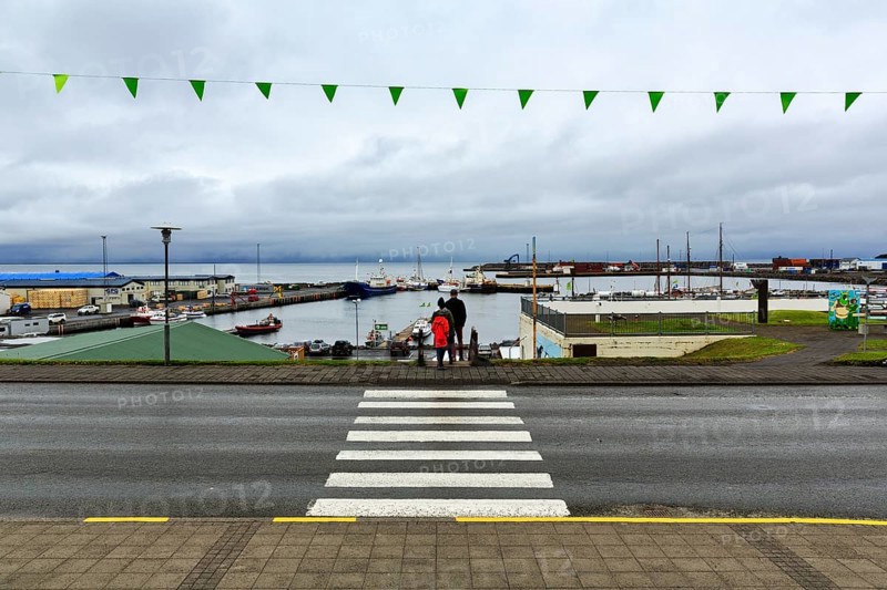 View of the harbour, fishing village at Skjalfandi Bay, rain clouds, Husavik, Húsavík, North Iceland, Iceland