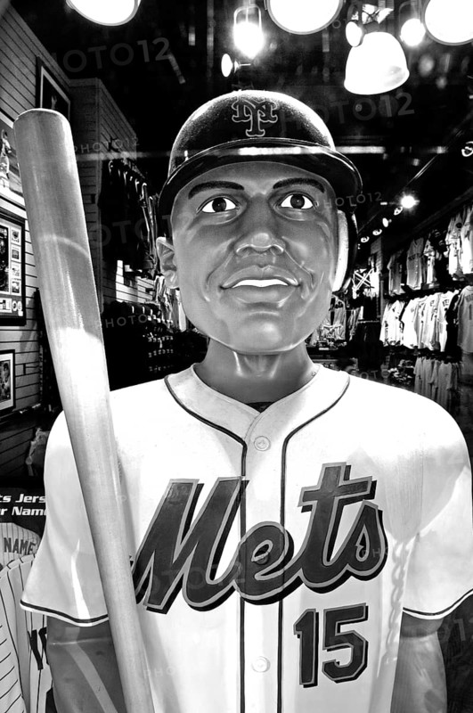 Baseball figure in a sports shop, black and white, New York City, USA