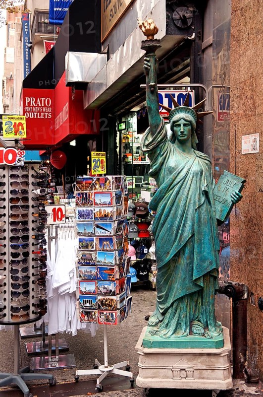 Souvenir shop with large Statue of Liberty, postcards and sunglasses, New York City, USA
