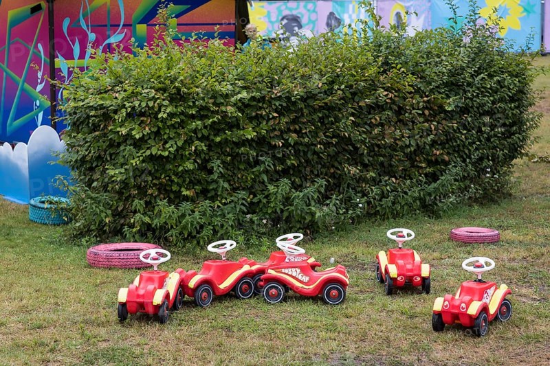 Unused bobby cars are parked in a corner of the Kidzapalooza at the Lollapalooza Festival in the Olympic Stadium and on the Maifeld, Berlin, 12.07.2025