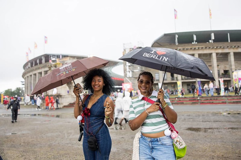 Festival visitors with Berlin umbrellas in front of the Olympic Stadium at the Lollapalooza Festival in the Olympic Stadium and on the Maifeld, Berlin, 12.07.2025
