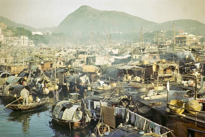 People living on sampan boats in the harbour at Aberdeen, Hong Kong, Asia 1964