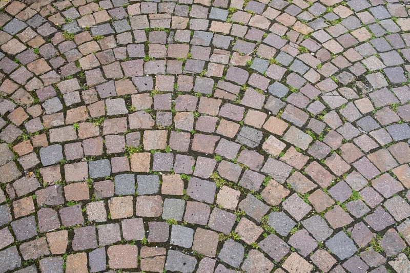 Intertwined cobblestones in an arched pattern, dominant colours are grey and pink, cobblestones, North Rhine-Westphalia, Germany