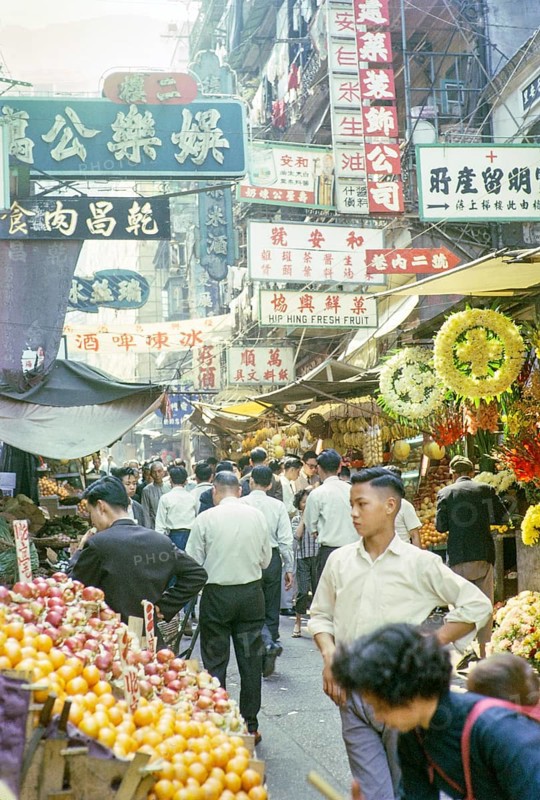 Captioned as 'Chinese fruit and flower stalls', Victoria, Hong Kong, Asia 1964