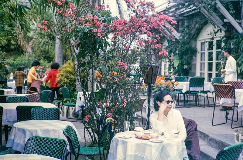Woman sitting at table of restaurant at the Peak, Hong Kong, Asia, 1964