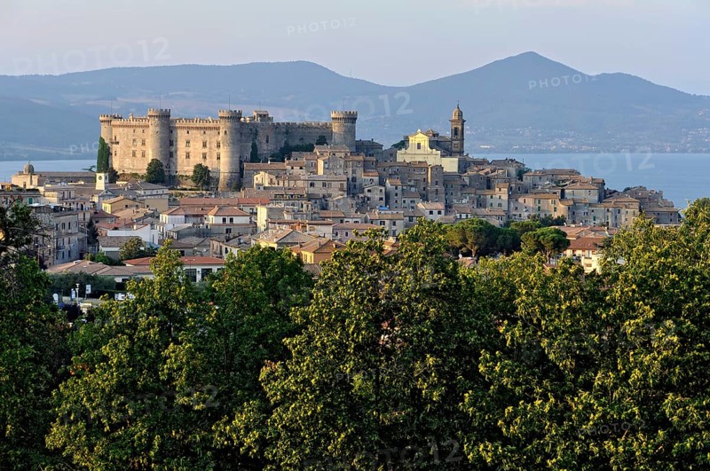 Castello Odescalchi fortress, Duomo Santo Stefano cathedral, behind Lake Bracciano, Lago di Bracciano, old town centre, Bracciano, metropolitan city of Rome, Lazio, Italy