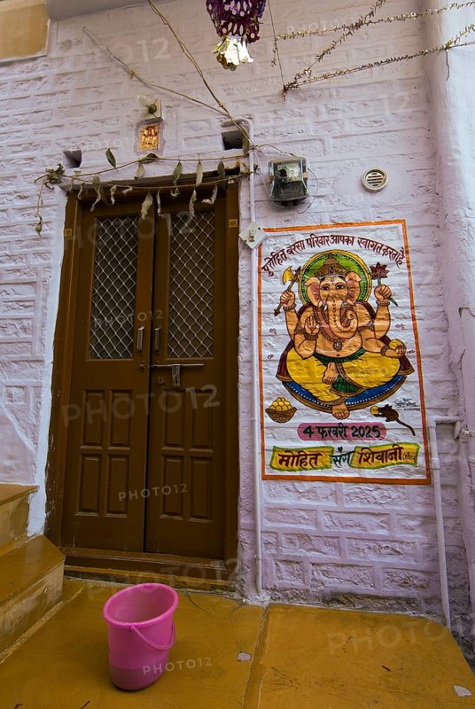 Colourful Ganesha image next to a front door in the fortress of Jaisalmer, Rajasthan, India