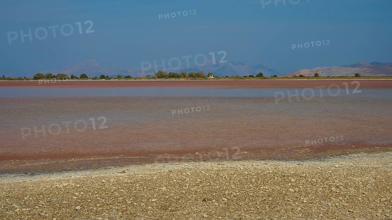 Lake with blue sky and brown shore in the distance, salt lake, Tigaki, nature reserve, hydro biotope, Kos, Dodecanese, Greek Islands, Greece