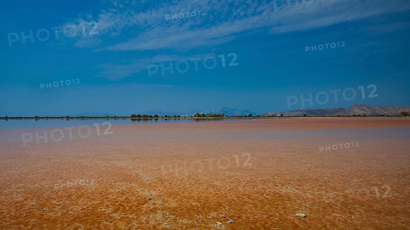 Wide, open landscape with a lake under a narrow blue sky, quiet atmosphere, salt lake, Tigaki, nature reserve, hydro-biotop, Kos, Dodecanese, Greek Islands, Greece