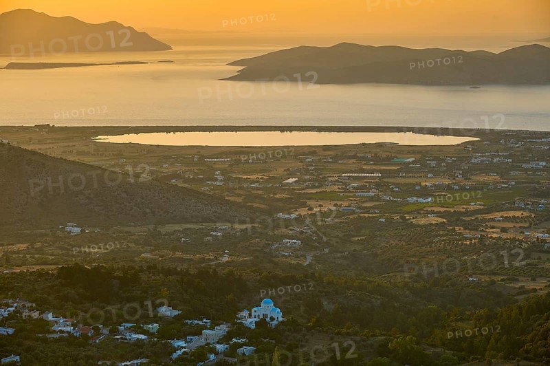 A view of a village and fields in front of the sea at sunset, salt lake, Tigaki, nature reserve, hydro biotope, Kos, Dodecanese, Greek Islands, Greece