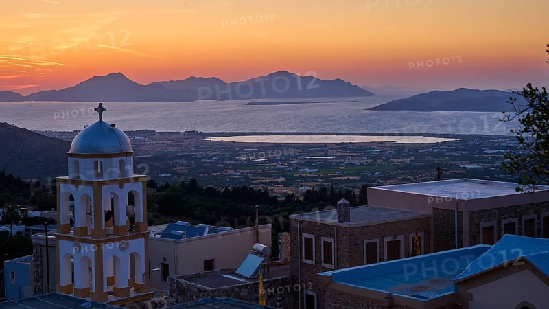 A church at sunset with a view of the sea and the islands, salt lake, Tigaki, nature reserve, hydro biotope, Kos, Dodecanese, Greek islands, Greece