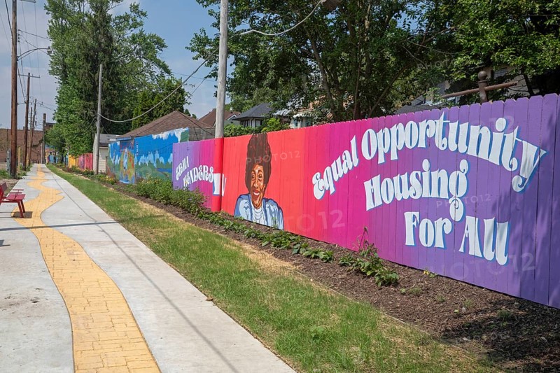 Detroit, Michigan - The city of Detroit is opening nine 'Arts Alleys' in neighborhoods around the city. The Yellow Brick Road Arts Alley provides a space for children to ride their bikes and learn about African-American history. Erma Henderson (fence image) was the first African-American elected to the Detroit City Council