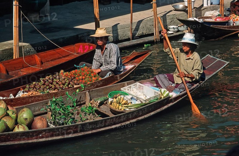 Merchants in their boats at Damnoen Saduak Floating Market, Thailand, December 2002, vintage, retro, old, historic