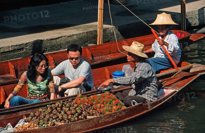 Retailers and customers in their boats at the Damnoen Saduak floating market, Thailand, December 2002, vintage, retro, old, historic