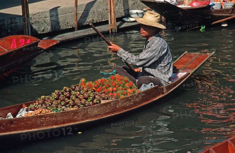Merchant in his boat at Damnoen Saduak Floating Market, Thailand, December 2002, vintage, retro, old, historic