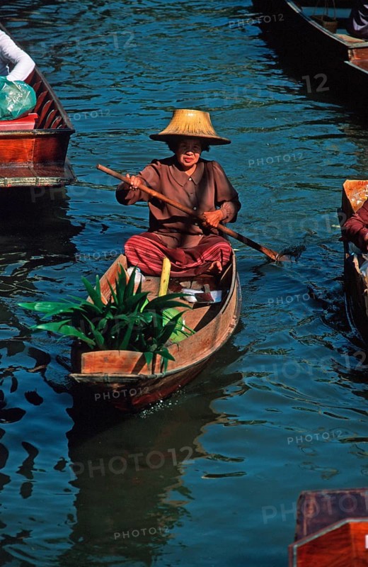 Merchant in her boat at Damnoen Saduak Floating Market, Thailand, December 2002, vintage, retro, old, historic