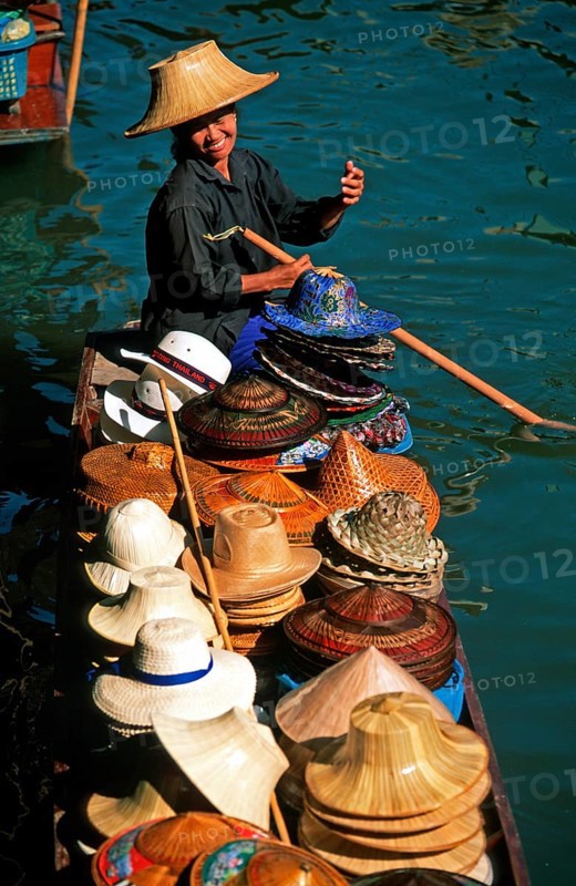 Hat seller in her boat at Damnoen Saduak Floating Market, Thailand, December 2002, vintage, retro, old, historic