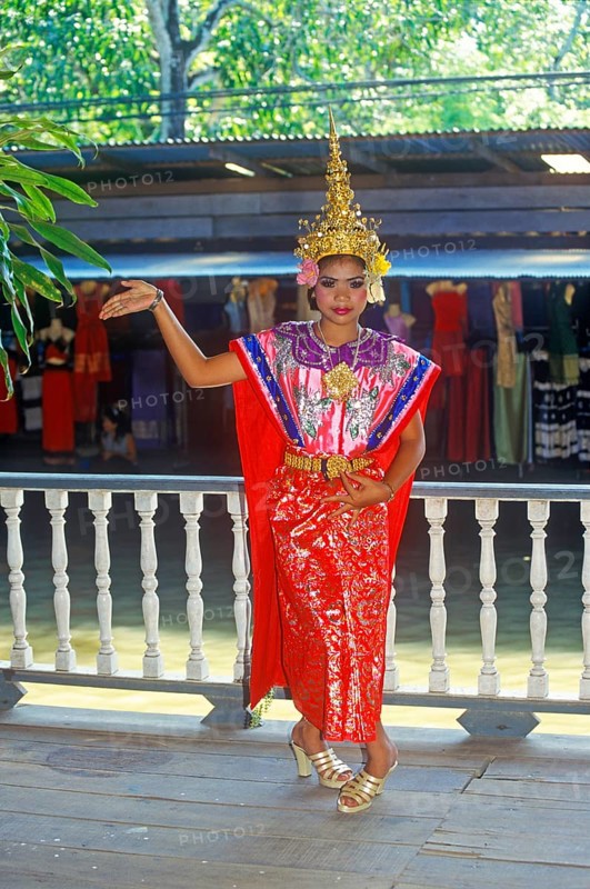 Young person wearing Thai drama clothes at Damnoen Saduak Floating Market, Thailand, December 2002, vintage, retro, old, historic
