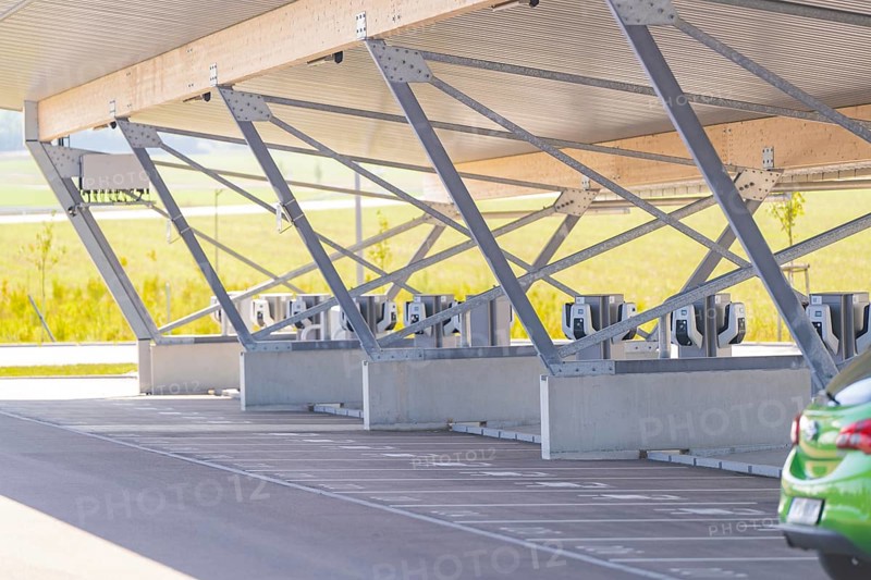 Modern architecture of a parking garage with charging stations and metal supports, e-charging park, Merklingen, Germany