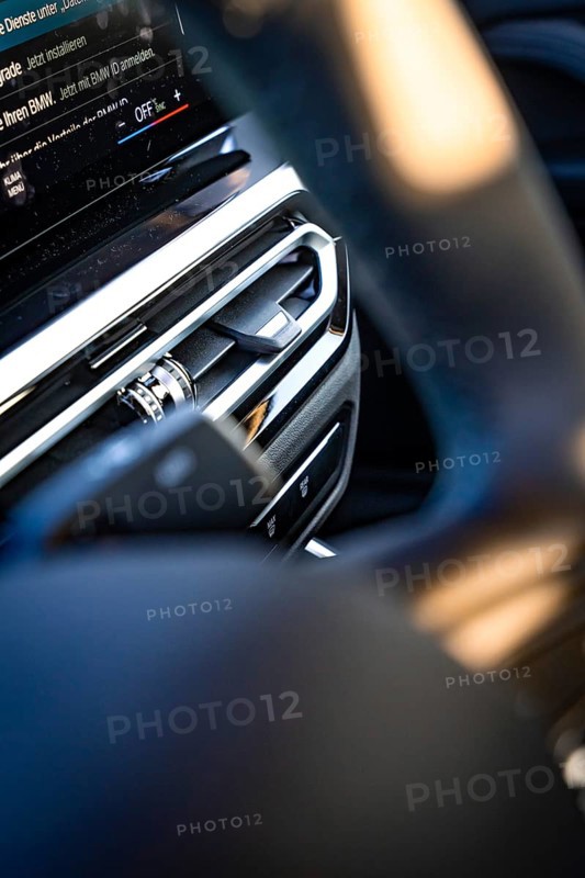 Close-up of a modern car interior with focus on steering wheel and dashboard, BMW i7 electric car, Deer e-Carsharing, Calw, Germany