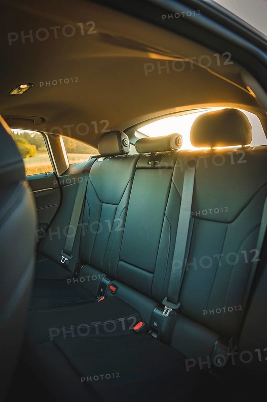 Interior view of car with back seats in sunset light, BMW i7 electric car, Deer E- Carsharing, Calw, Germany