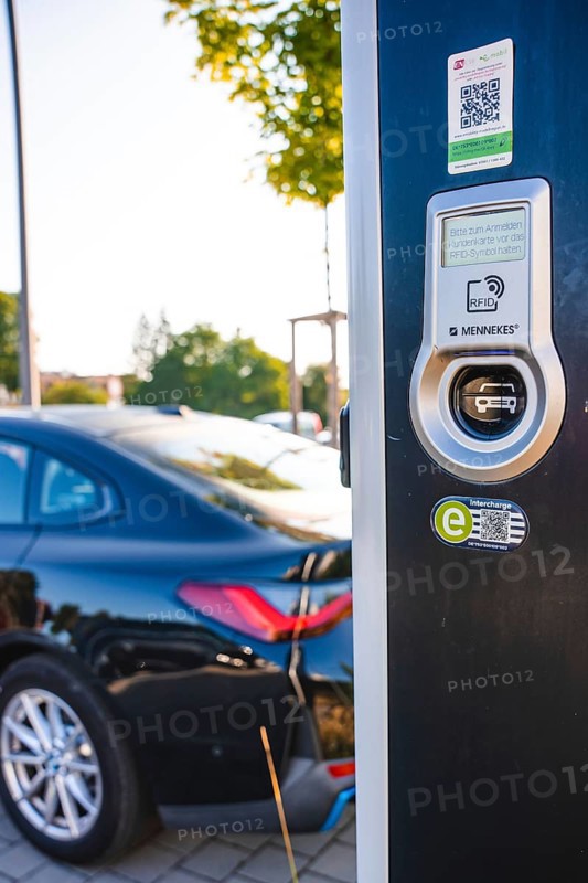 Electric car at a charging station, modern design with QR code and environmentally friendly symbols, BMW i7 electric car, deer e-car sharing, Calw, Germany