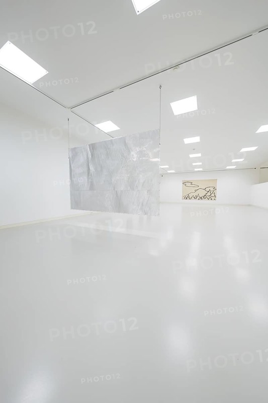 Minimalist gallery space with hanging metal artwork in the foreground, Schauwerk, Sindelfingen, Germany