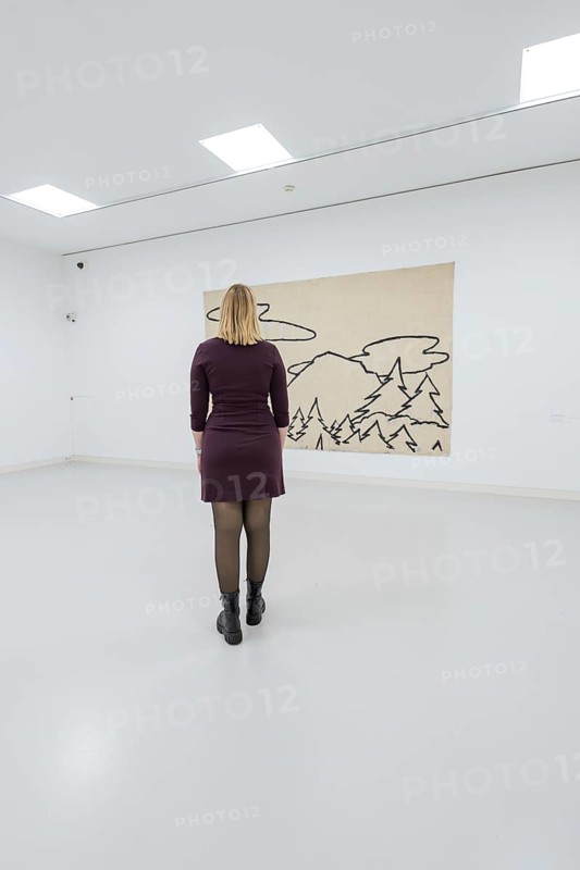 A woman stands in front of a modern work of art in a bright gallery, Schauwerk, Sindelfingen, Germany
