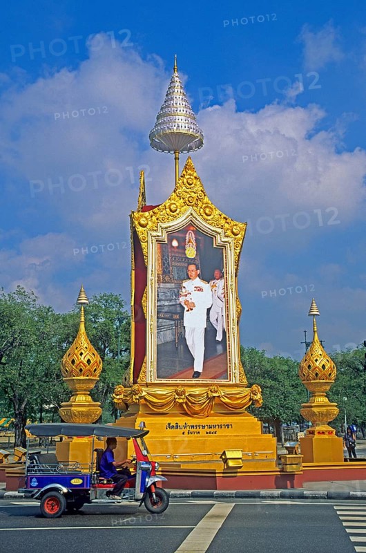 Tuk-tuk, portrait of King Bhumipol at a crossroads in Bangkok, Thailand, December 2002, vintage, retro, old, historic
