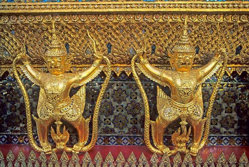 Golden mythical creatures, statues, Garudas, at Wat Phra Kaeo, Bangkok, Thailand, December 2002, vintage, retro, old, historical