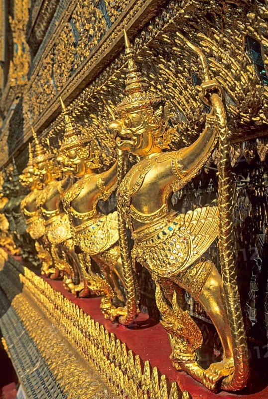 Golden mythical creatures, statues, Garudas, at Wat Phra Kaeo, Bangkok, Thailand, December 2002, vintage, retro, old, historical
