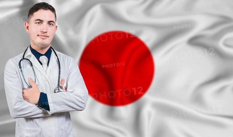 Portrait of medical professional on Japan flag background. Japanese national health system