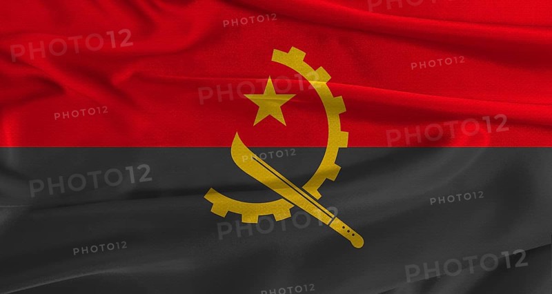 Flag of Angola with fabric textured background. Close up of National flag of Angola with realistic texture