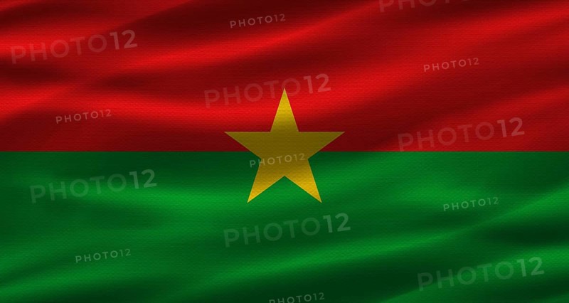 Burkinabé flag with fabric texture. Realistic flag of Burkina Faso waving